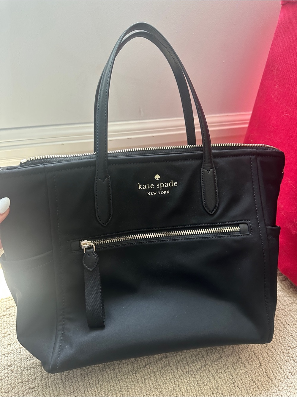 kate spade black nylon tote with front zip pocket and top handles